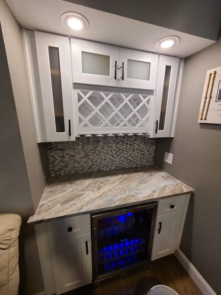 Custom wet bar with wine fridge and backsplash