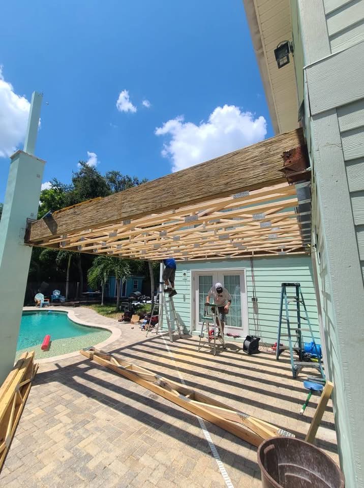 Wooden pergola construction over pool area