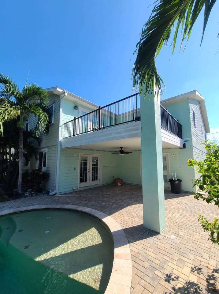 Coastal home exterior with pool and deck