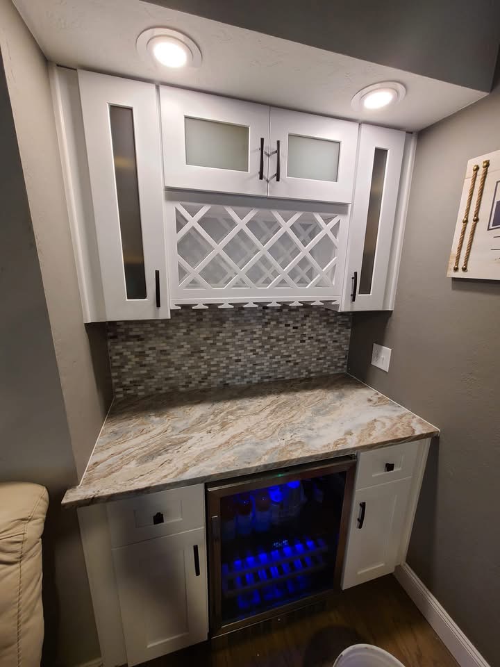 Custom wet bar with wine fridge and backsplash